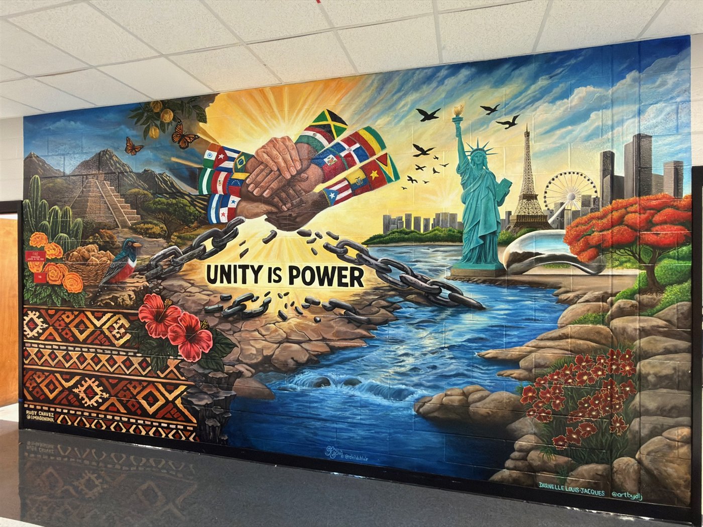 Unity Is Power, a collaborative mural for the ESOL Department at Tri-Cities High School in East Point, Georgia, painted by Reinilda Blair with Darnelle Louis-Jacques and Ruby Chaves