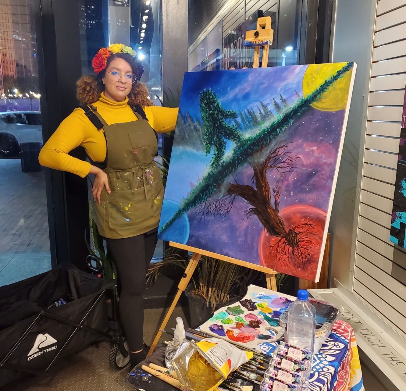 Reinilda painting a landscape live outdoors at a private event