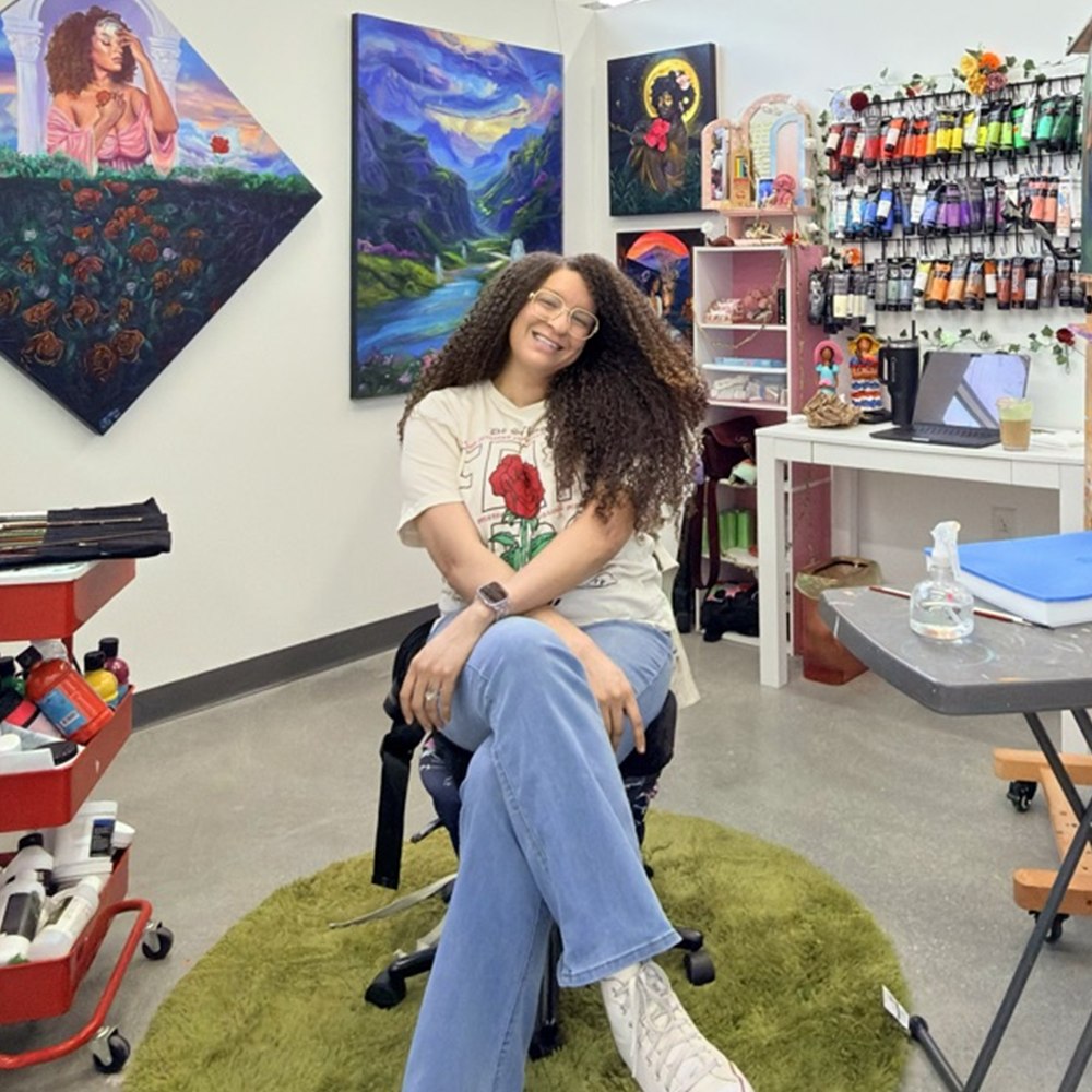 Reinilda Blair in her studio at Spruill Studios in Chamblee, Georgia, surrounded by her paintings